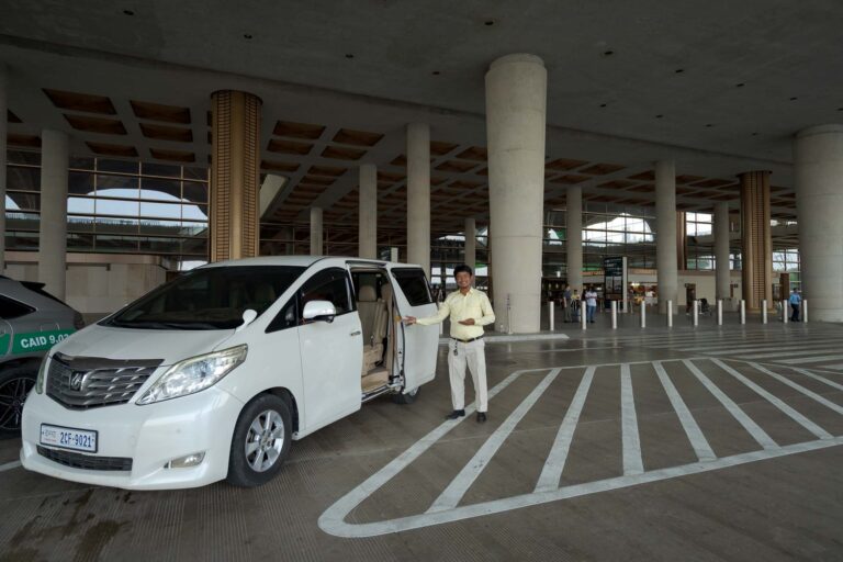 driver with toyota alphard at arrivals area of KTI Airport waiting for a pick up of a passenger