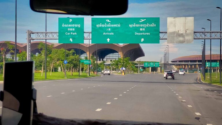 Road sign for Phnom Penh International Airport KTI